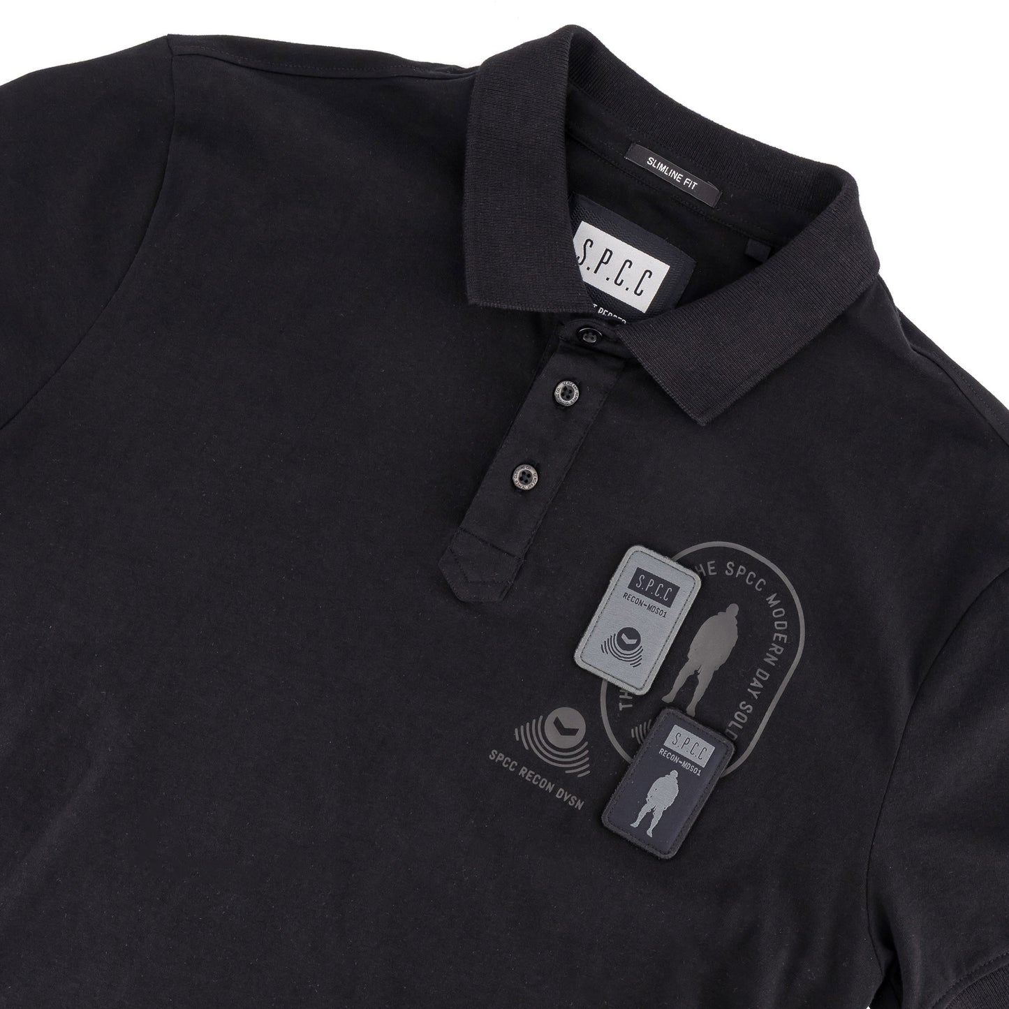Recon Escalade Golfer - Black polo shirt featuring SPCC badge and print detail.