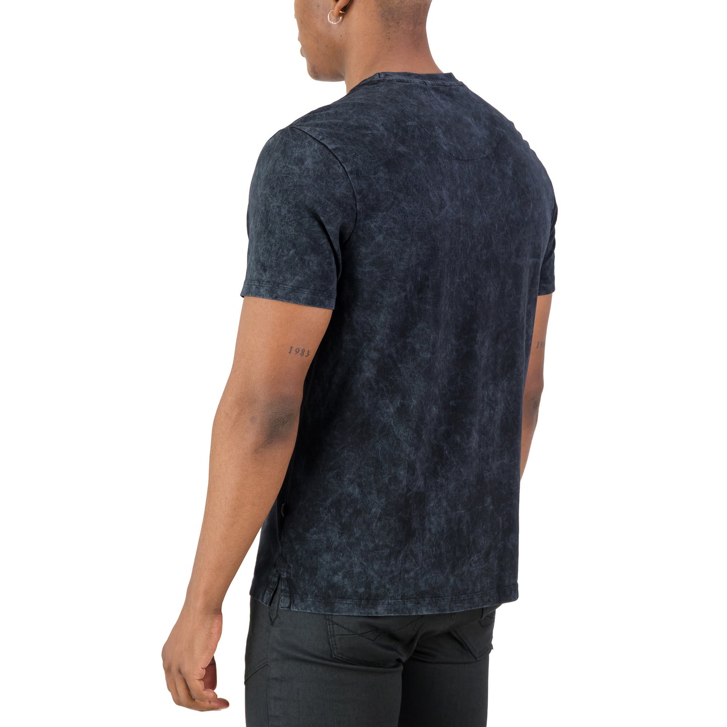 Men's back view of the Rodgers Tee - Black showing its unique garment-washed texture and regular fit.