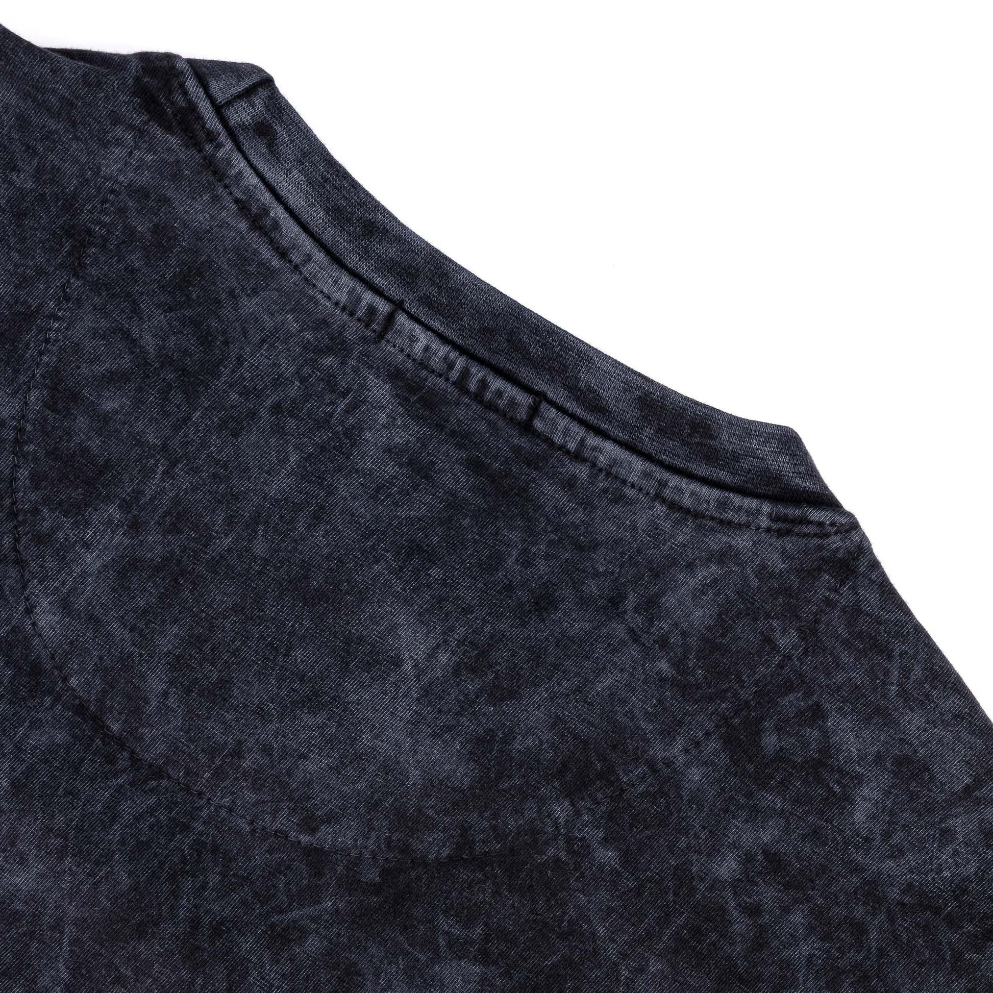 Close-up of the neckline and fabric texture of the Rodgers Tee - Black, showcasing its unique garment-washed design.