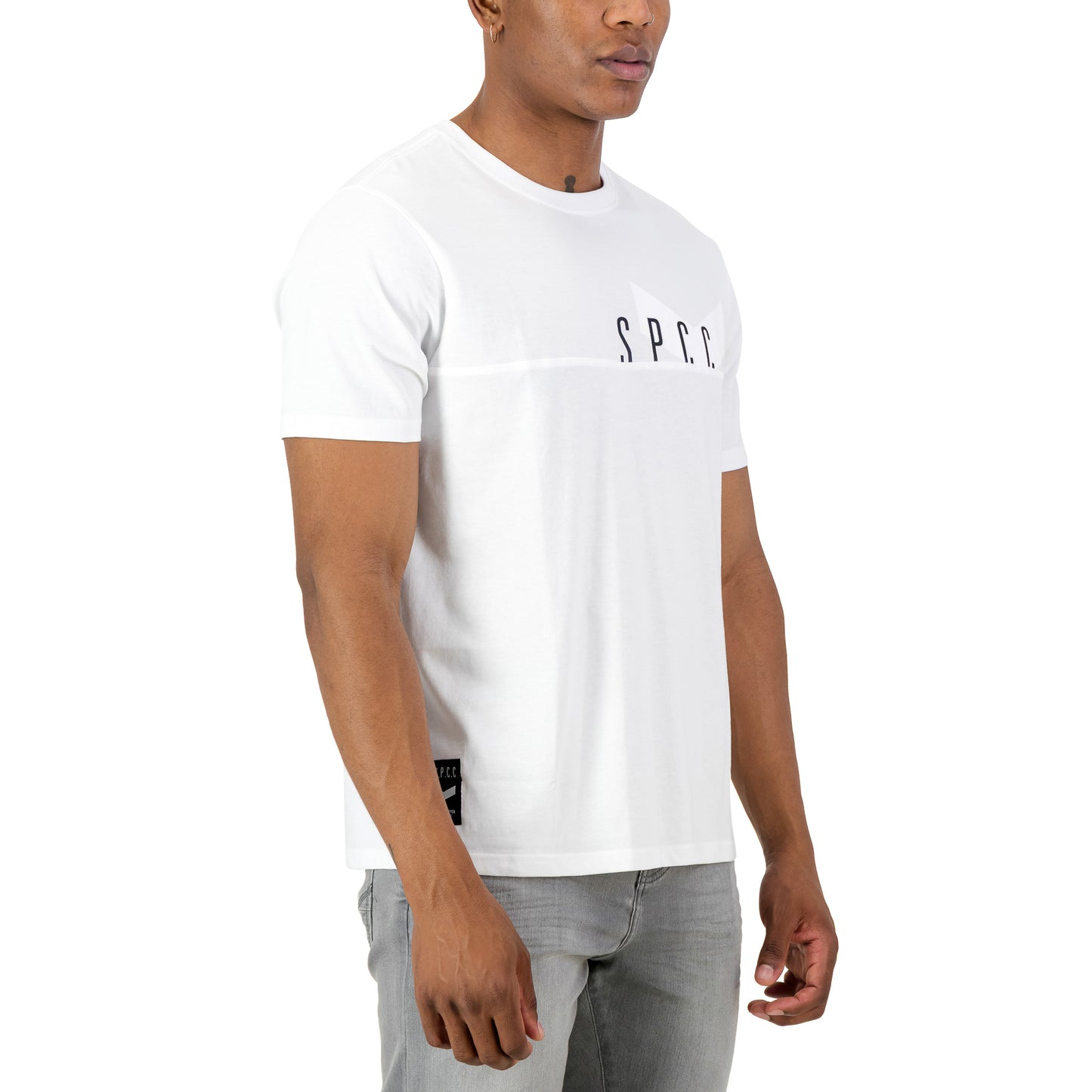 Surge Atlas Tee - White on model showcasing refined streetwear style with SPCC print on chest.