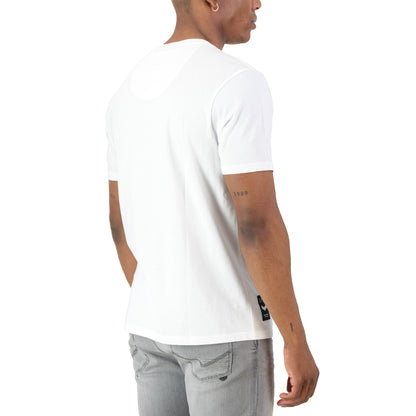 Back view of a man wearing the Surge Atlas Tee - White, showcasing its refined streetwear style and comfort.