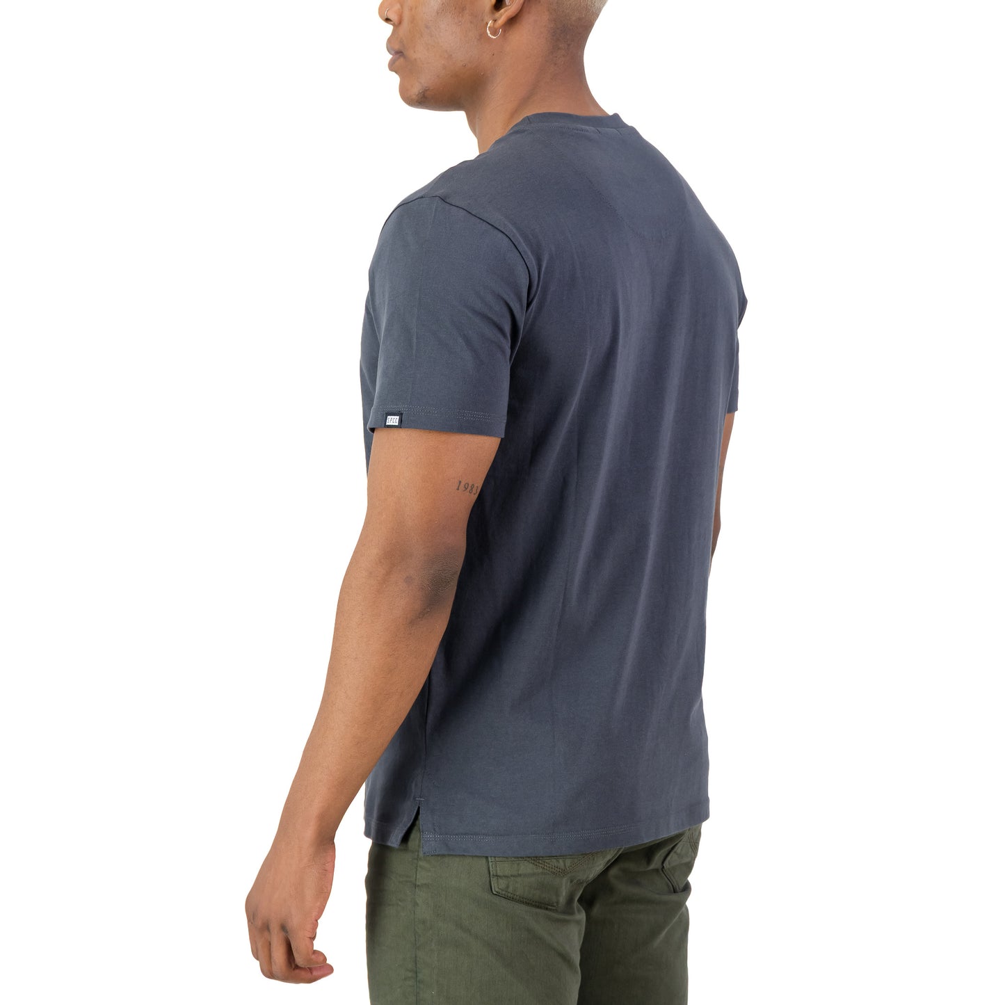 Rhett Tee - Charcoal displayed on a model from the back, showcasing its slimline fit and SPCC details.