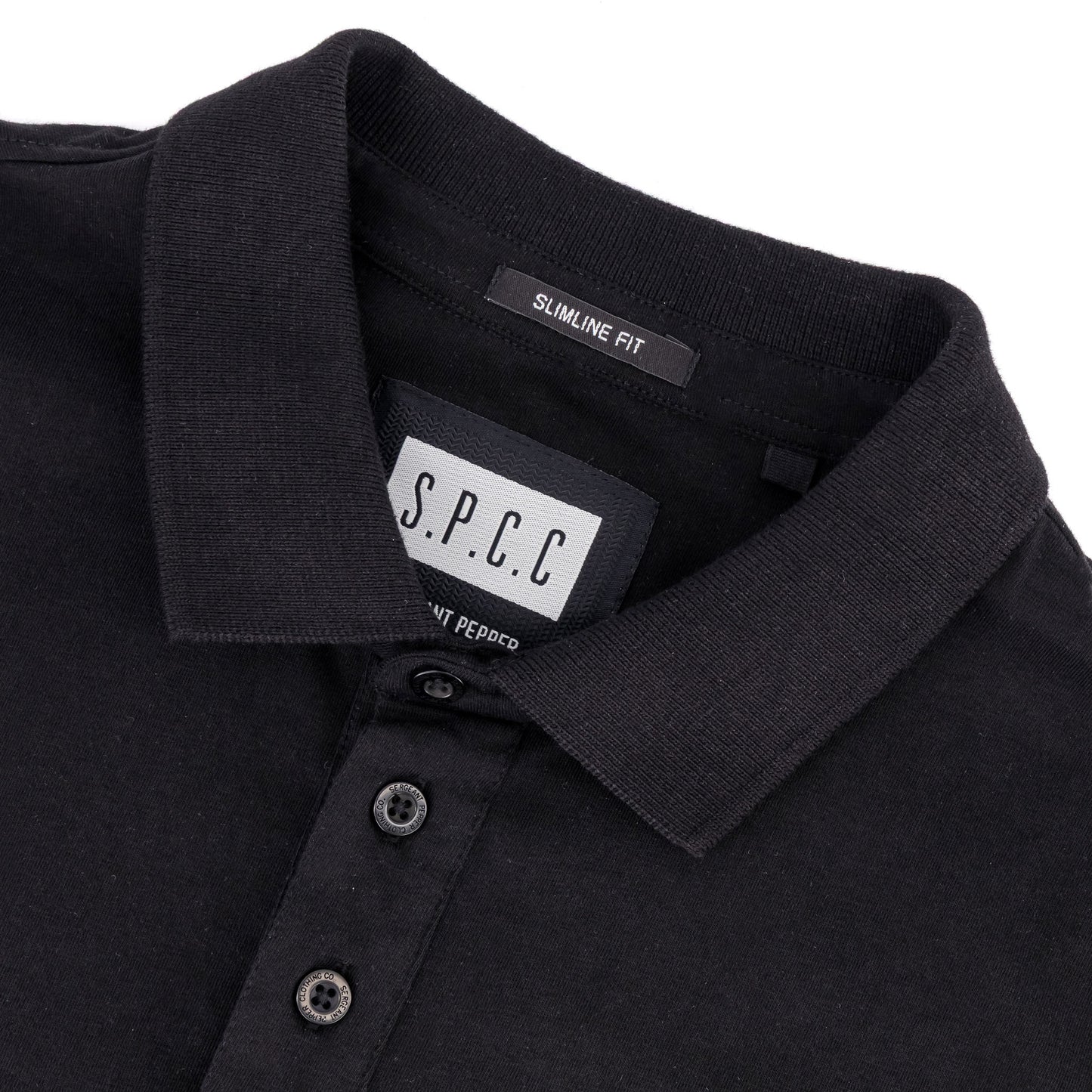 Recon Escalade Golfer - Black close-up of collar and tag, showcasing premium cotton pique jersey and slimline fit design.