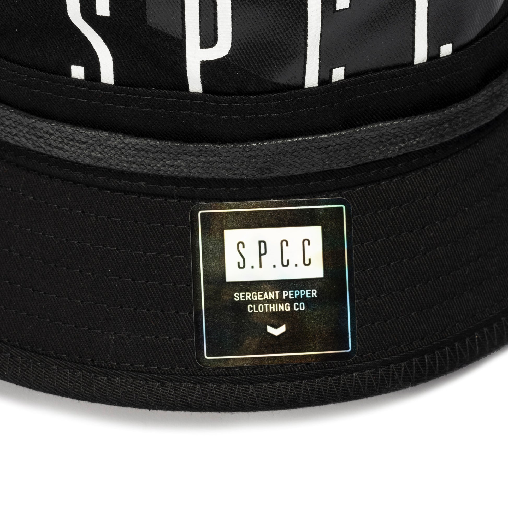 Surge Atlas Bucket Hat - Black with SPCC logo and twill detailing, showcasing urban street style.