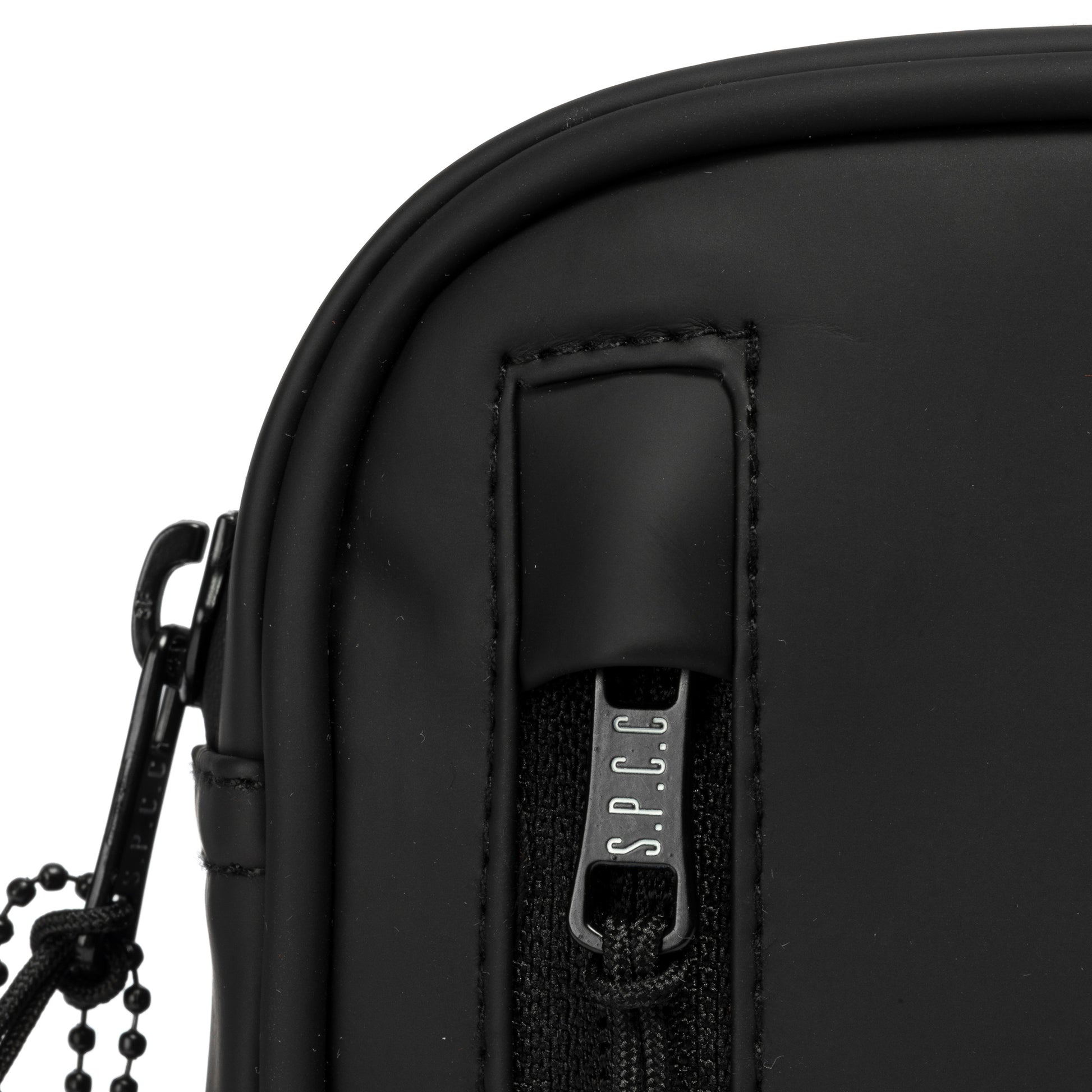 Surge Atlas Hip Bag - Black close-up view of zipper and technical fabric detailing