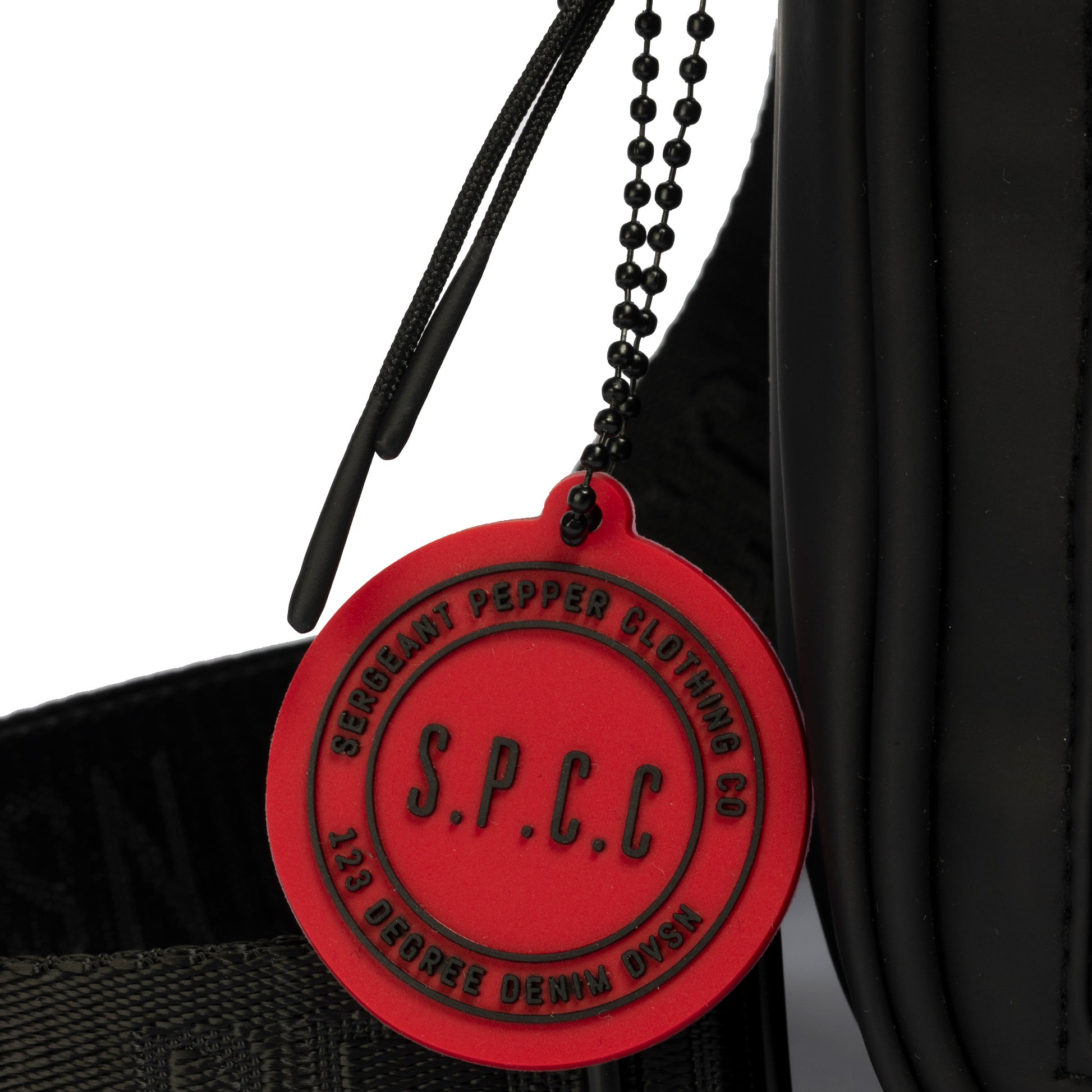 Surge Atlas Hip Bag - Black with red SPCC tag and adjustable strap showcasing its modern design.