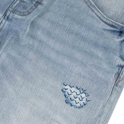 Typhoon Jeans - Bleach close-up of the embroidered detail on durable denim in a heavy bleach wash.