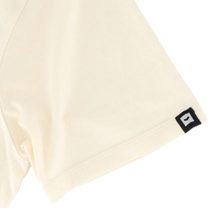 Romain Tee - Off White showcasing the SPCC woven badge on cuff and soft-touch fabric detail.